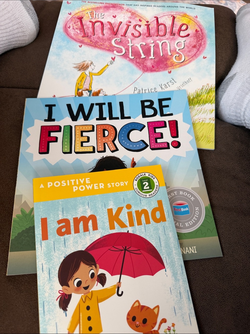 3 softcover kids books.
